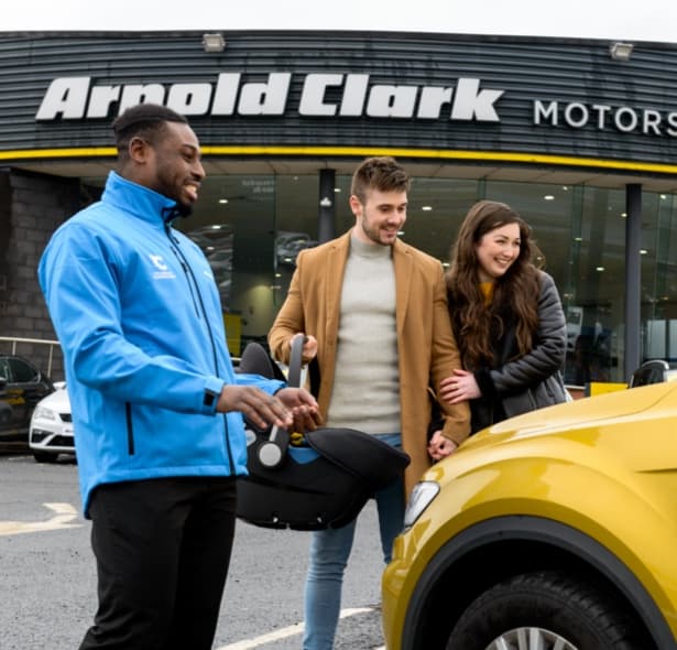 Product Consultant showing customers' their car