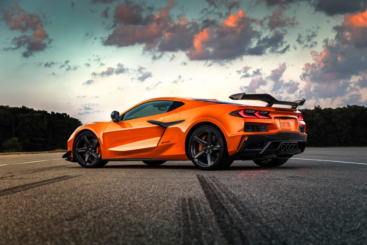 Rear angled side view of orange Corvette Z06