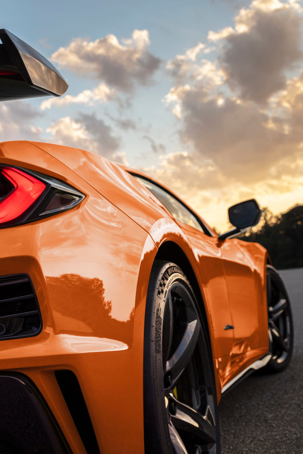 Angled close-up view of orange Corvette Z06 rear