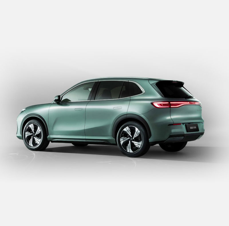 Rear side-on view of metallic green Geely EX5