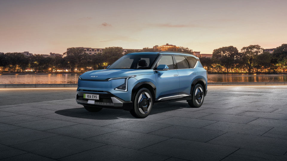 Angled view of the Kia EV5 showing off the front and side of the futuristic-looking body