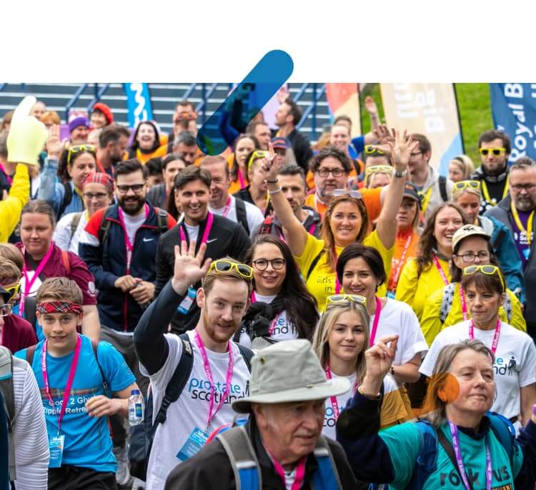 Crowd of people waving at the Kiltwalk